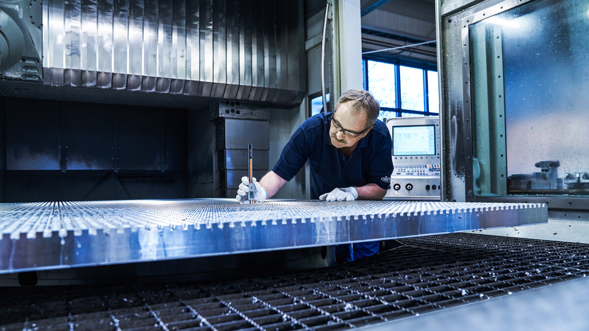 Alimex employee measures metal